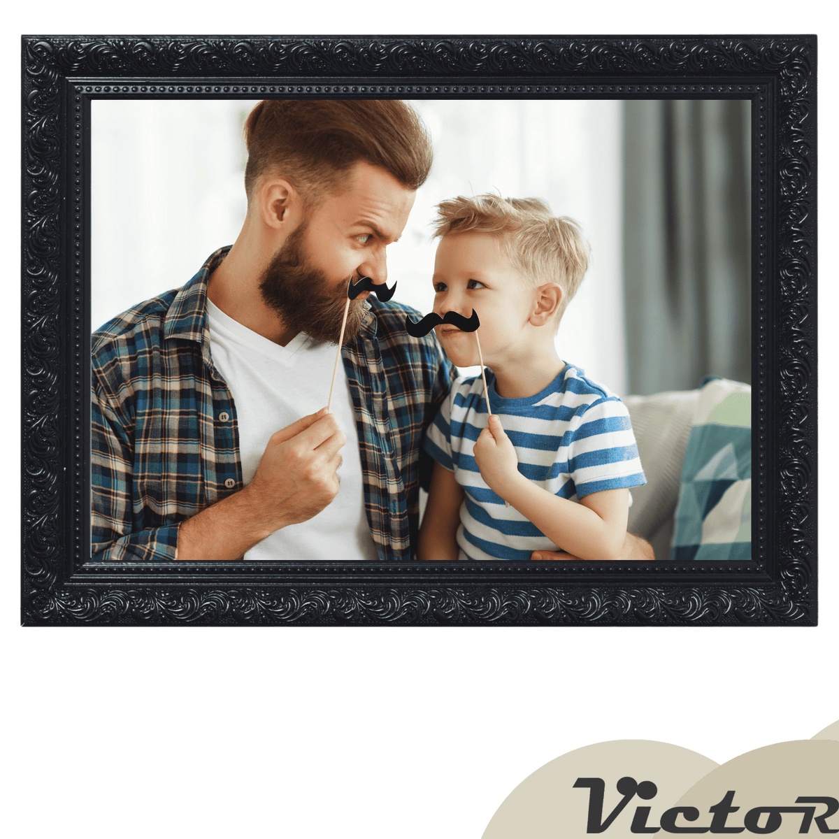 A father and son playfully pose with stick-on mustaches, smiling at each other.